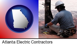 Atlanta, Georgia - an electrician wearing a tool belt, installing electrical wiring