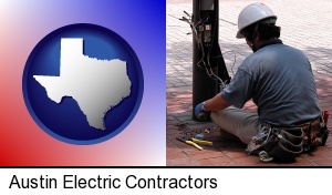 Austin, Texas - an electrician wearing a tool belt, installing electrical wiring