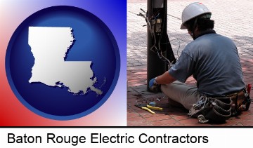 an electrician wearing a tool belt, installing electrical wiring in Baton Rouge, LA