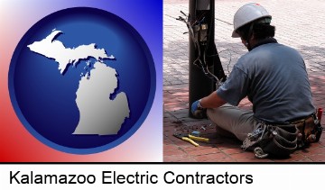 an electrician wearing a tool belt, installing electrical wiring in Kalamazoo, MI