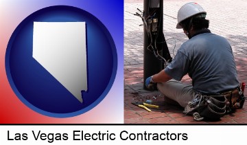 an electrician wearing a tool belt, installing electrical wiring in Las Vegas, NV