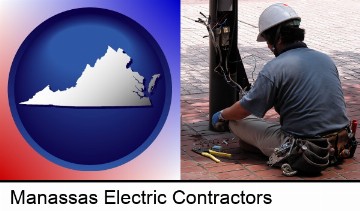an electrician wearing a tool belt, installing electrical wiring in Manassas, VA