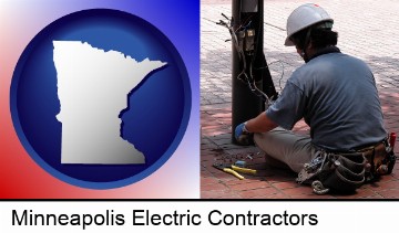 an electrician wearing a tool belt, installing electrical wiring in Minneapolis, MN