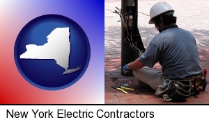 New York, New York - an electrician wearing a tool belt, installing electrical wiring