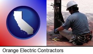 Orange, California - an electrician wearing a tool belt, installing electrical wiring