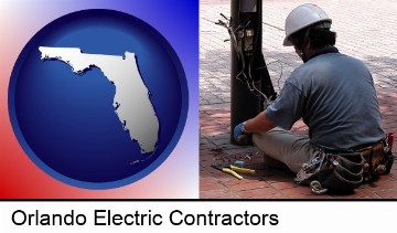 an electrician wearing a tool belt, installing electrical wiring in Orlando, FL