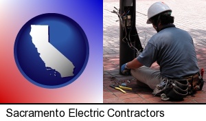 Sacramento, California - an electrician wearing a tool belt, installing electrical wiring