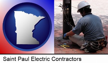 an electrician wearing a tool belt, installing electrical wiring in Saint Paul, MN