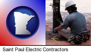 Saint Paul, Minnesota - an electrician wearing a tool belt, installing electrical wiring