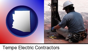 an electrician wearing a tool belt, installing electrical wiring in Tempe, AZ