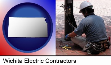 an electrician wearing a tool belt, installing electrical wiring in Wichita, KS