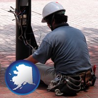 alaska map icon and an electrician wearing a tool belt, installing electrical wiring