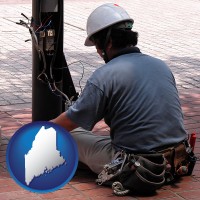 maine map icon and an electrician wearing a tool belt, installing electrical wiring