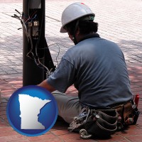 minnesota map icon and an electrician wearing a tool belt, installing electrical wiring