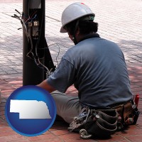 an electrician wearing a tool belt, installing electrical wiring - with NE icon