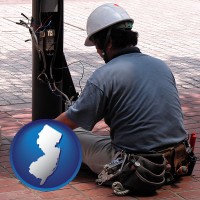 new-jersey map icon and an electrician wearing a tool belt, installing electrical wiring