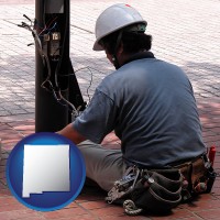 new-mexico map icon and an electrician wearing a tool belt, installing electrical wiring