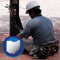 ohio map icon and an electrician wearing a tool belt, installing electrical wiring
