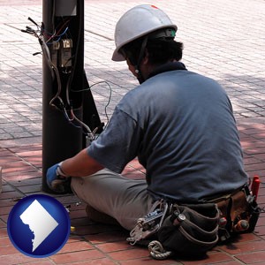 an electrician wearing a tool belt, installing electrical wiring - with Washington, DC icon