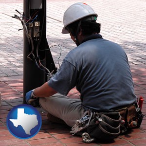 an electrician wearing a tool belt, installing electrical wiring - with Texas icon