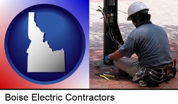 an electrician wearing a tool belt, installing electrical wiring in Boise, ID