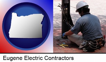 an electrician wearing a tool belt, installing electrical wiring in Eugene, OR