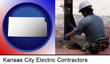 an electrician wearing a tool belt, installing electrical wiring in Kansas City, KS