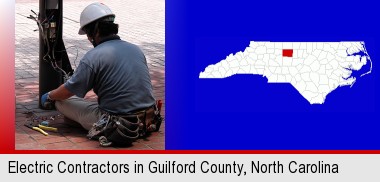 an electrician wearing a tool belt, installing electrical wiring; Guilford County highlighted in red on a map