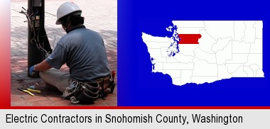 an electrician wearing a tool belt, installing electrical wiring; Snohomish County highlighted in red on a map